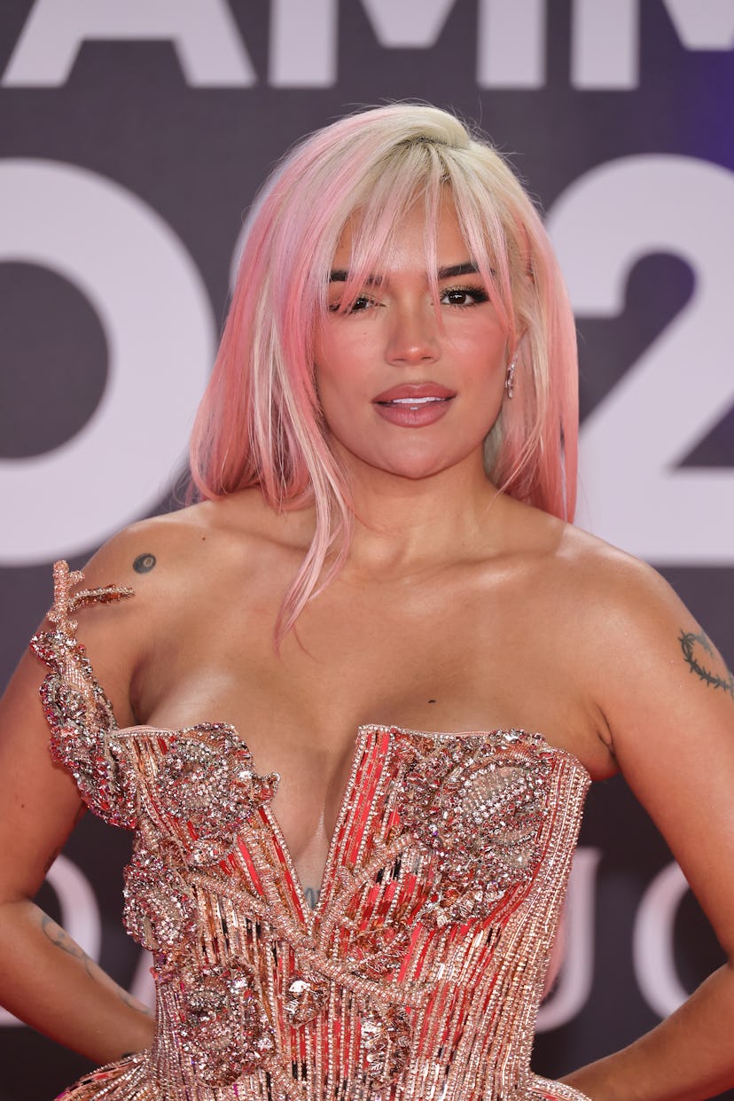 Karol G with peach fuzz highlights.