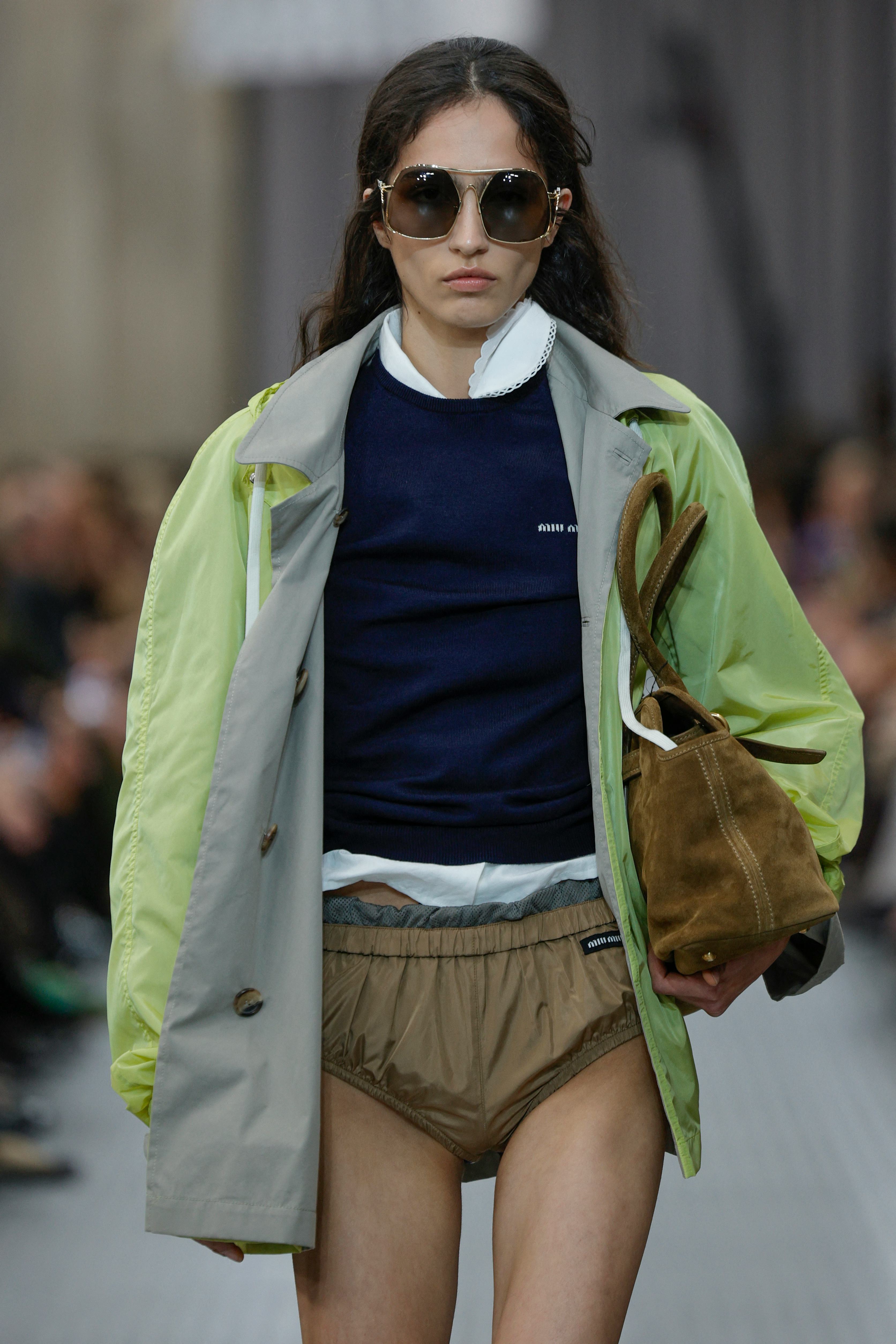 A model presents a creation by Miu Miu for the Women Ready-to-wear Spring-Summer 2025 collection as &hellip;