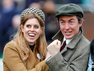 Princess Beatrice and Edoardo Mapelli Mozzi cheer as they watch the racing on day 3 'St Patrick's Th...