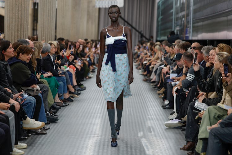 A model presents a creation by Miu Miu for the Women Ready-to-wear Spring-Summer 2025 collection as ...