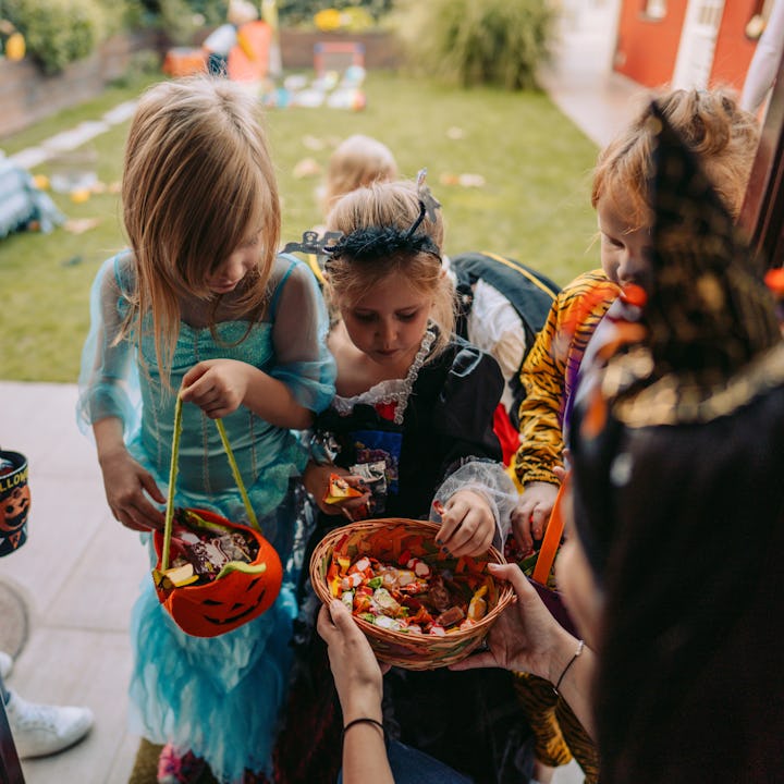 Group of kids trick or treating, in a story about trick-or-treat safety tips for parents.