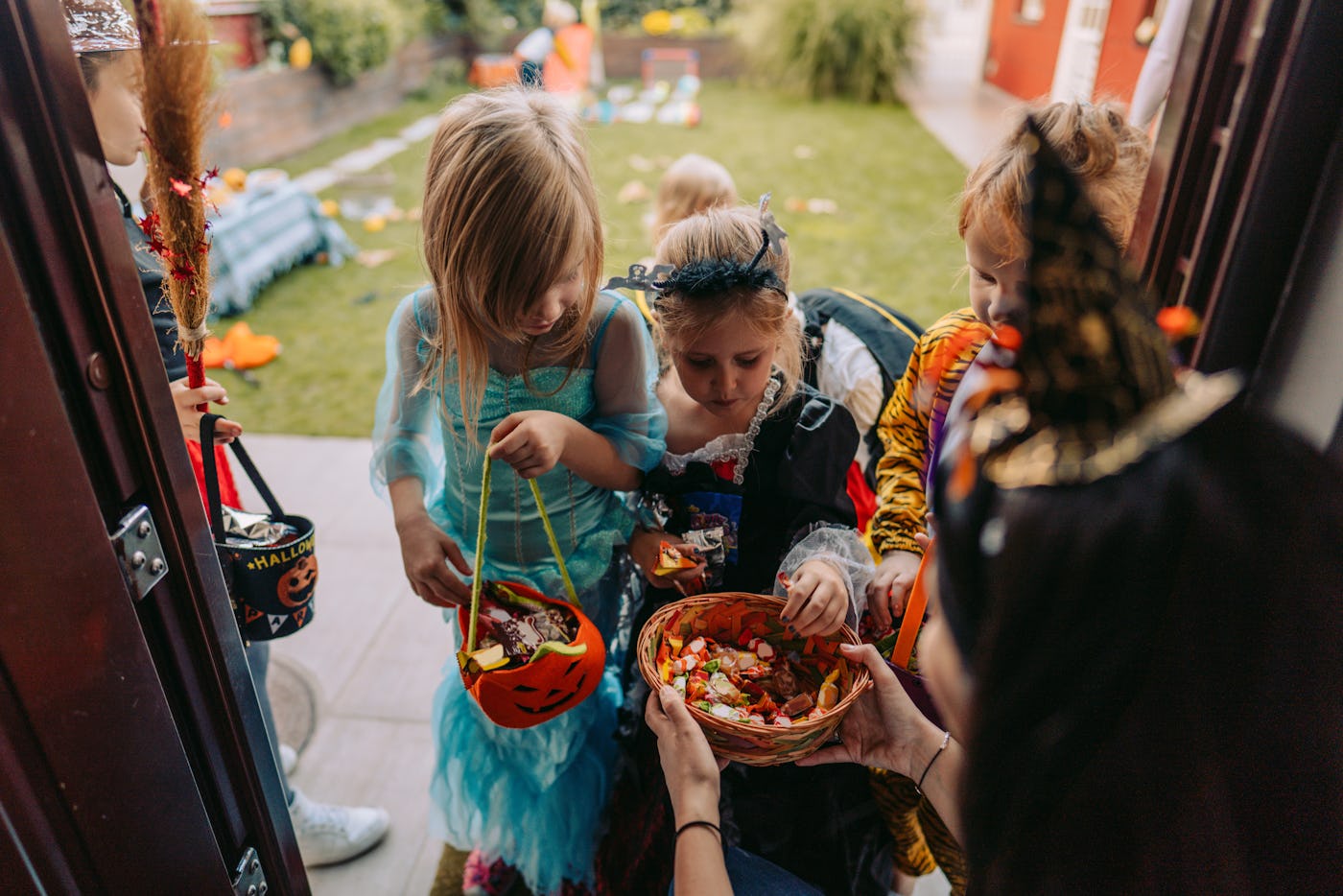 Group of kids trick or treating, in a story about trick-or-treat safety tips for parents.