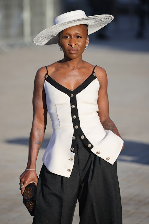 Cynthia Erivo, who leads the Wicked cast, in a white hat at top.