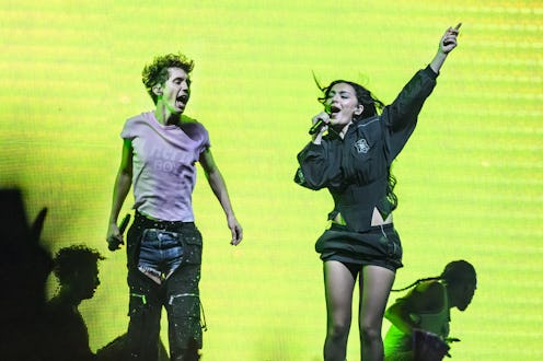 Charli XCX and Troye Sivan, who are on tour together, on stage in London.