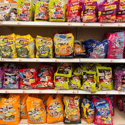 Large bags of Halloween candy for sale in Walgreens pharmacy. Chocolate and non-chocolate candy prices have increased for Halloween 2024.