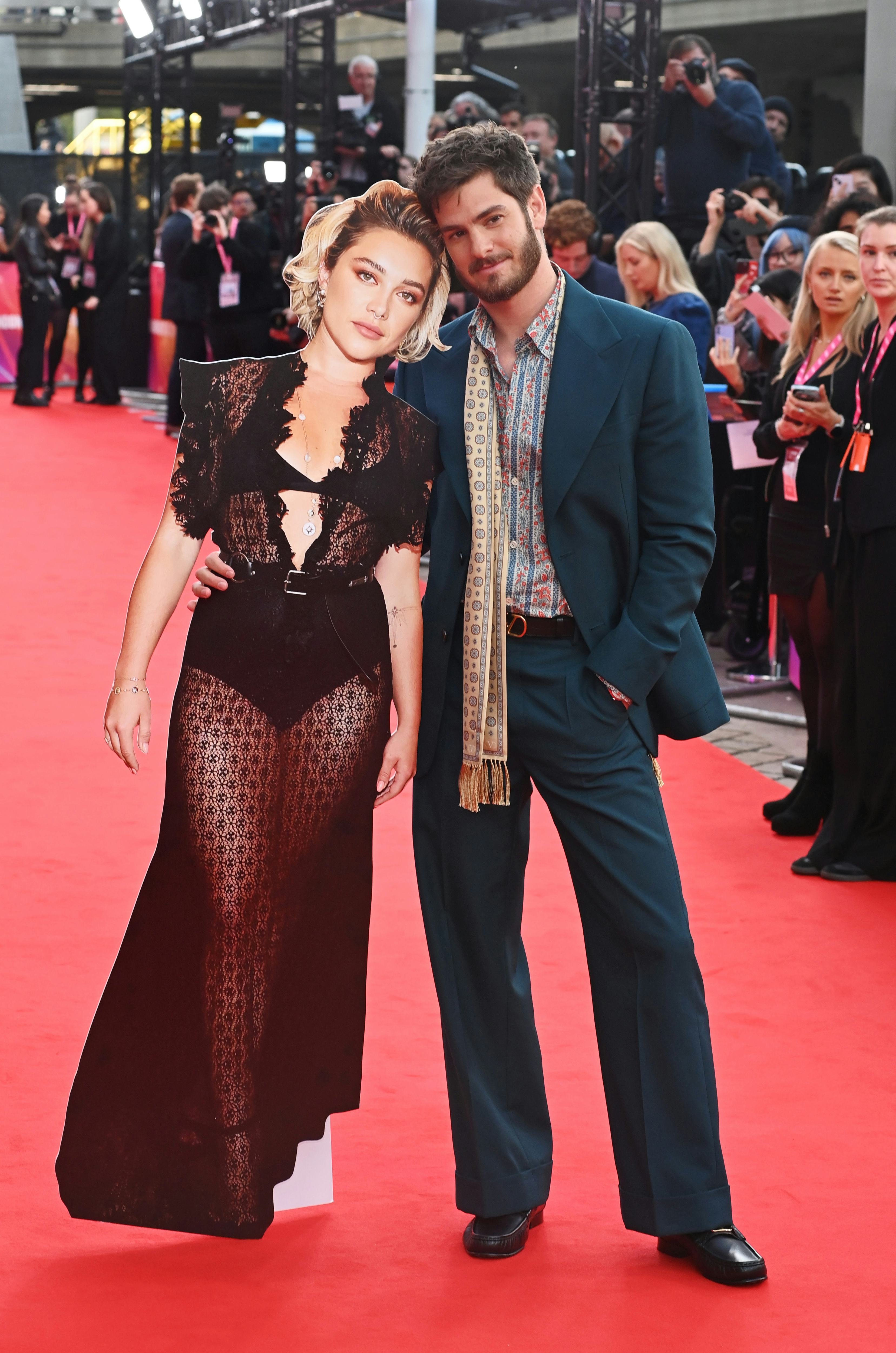 Why Did Andrew Garfield Walk The Red Carpet With a Cardboard Florence Pugh?