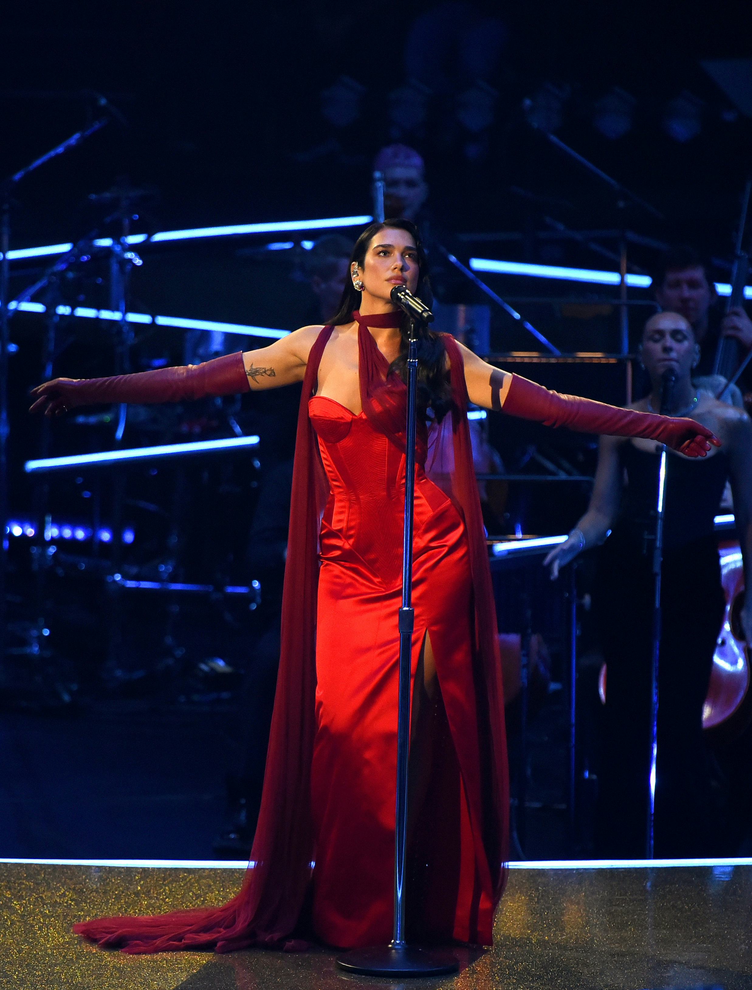 Dua Lipa wore an old Hollywood slit dress to a recent performance.
