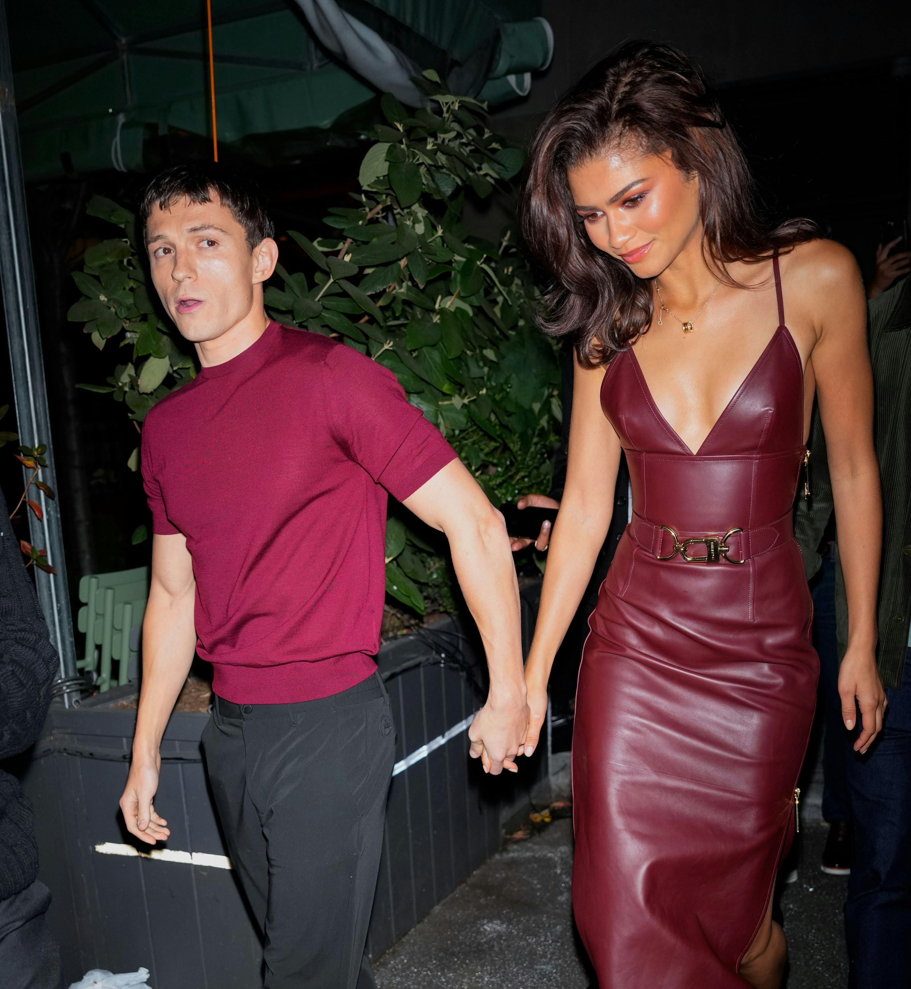 Zendaya wore a red-hot plunging dress on date night with Tom Holland.