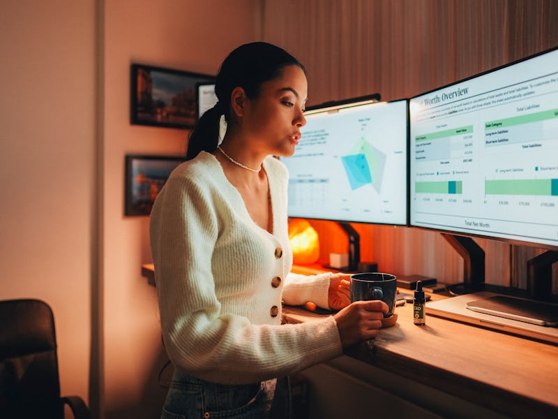 Businesswoman under pressure is using CBD oil in tea