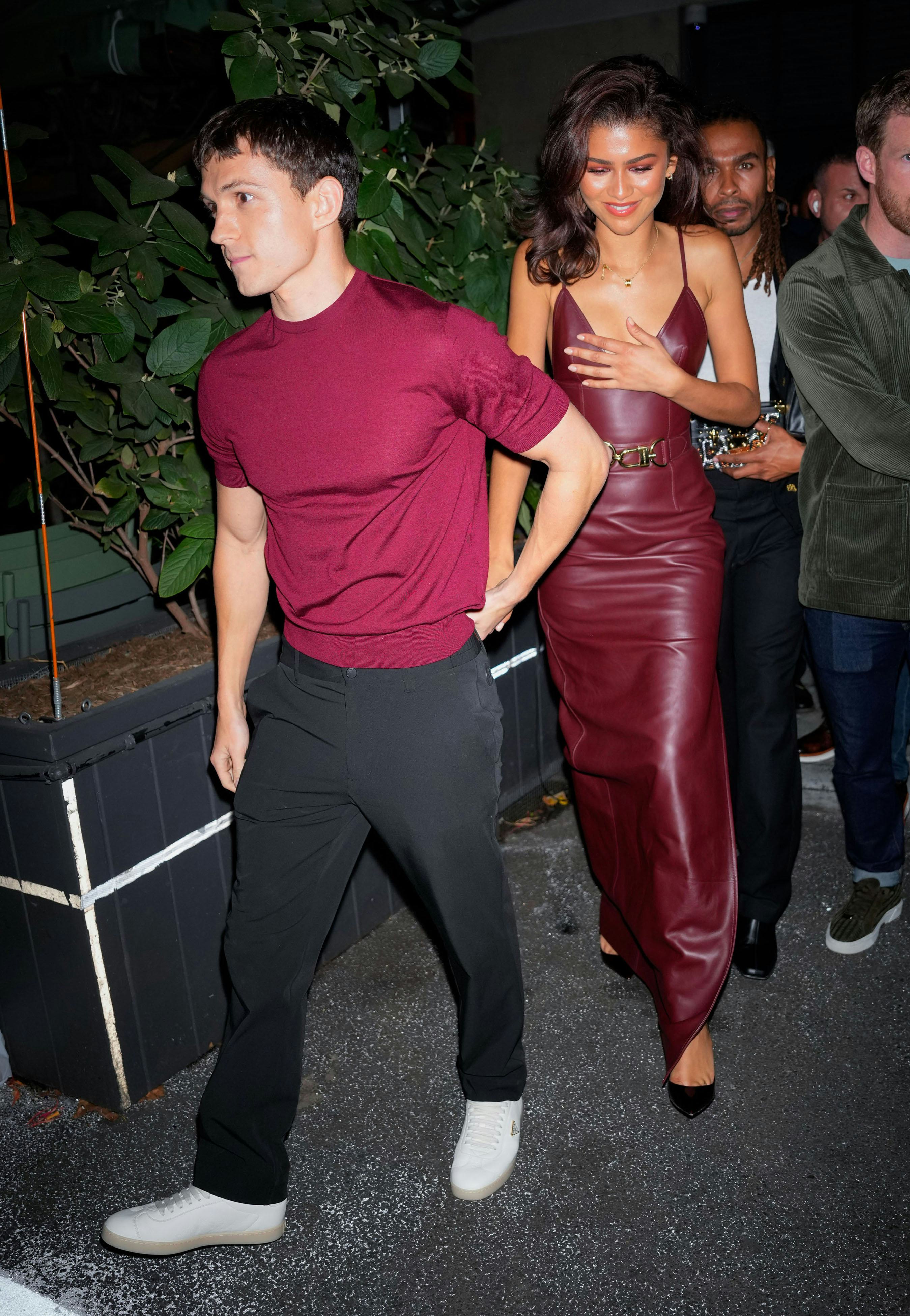 Zendaya wore a red-hot plunging dress on date with Tom Holland.