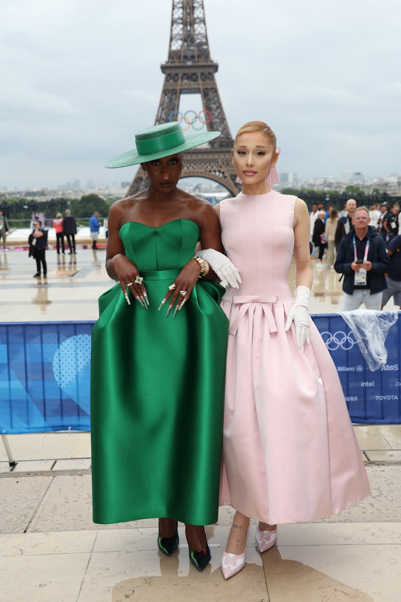 Cynthia Erivo (L) and Ariana Grande attends the red carpet ahead of the opening ceremony