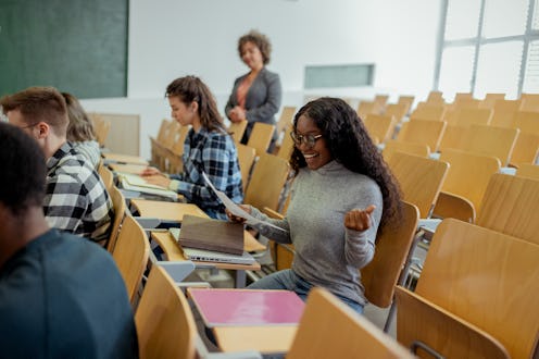 Black Female College Student Celebrating Her Academic Success With a Raised Fist at University Colle...