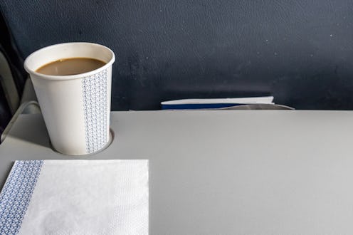 Coffee cup on an airplane seat, Brussels, Belgium