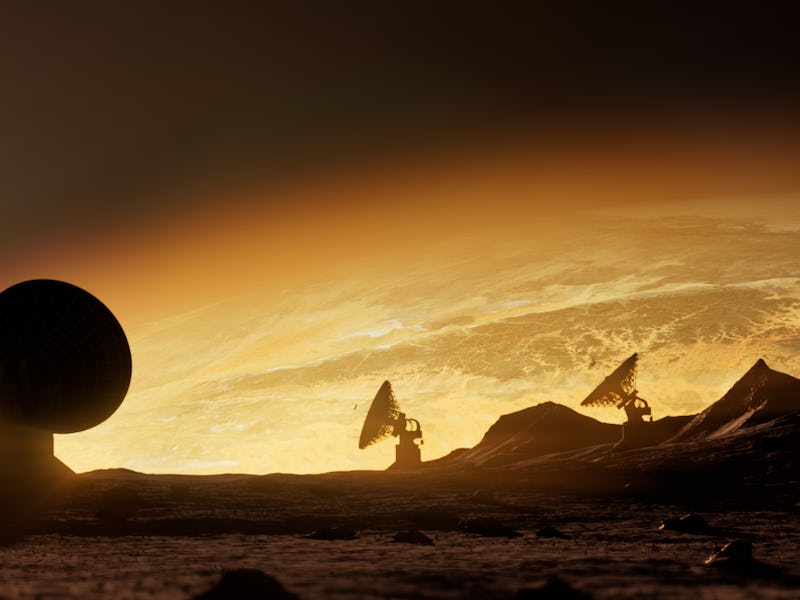 An alien terrain featuring parabolic antennas in the foreground and a luminous planet in the backgro...