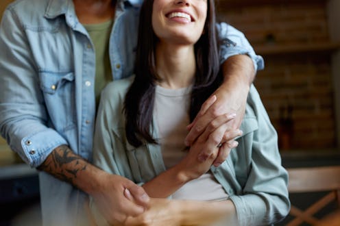 Close up of unrecognizable happy couple in love enjoying in their time at home.