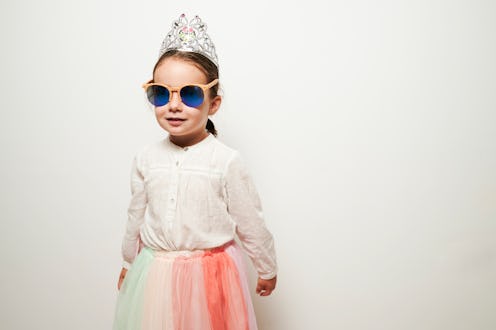 Portrait of little girl with princess headband and sunglasses