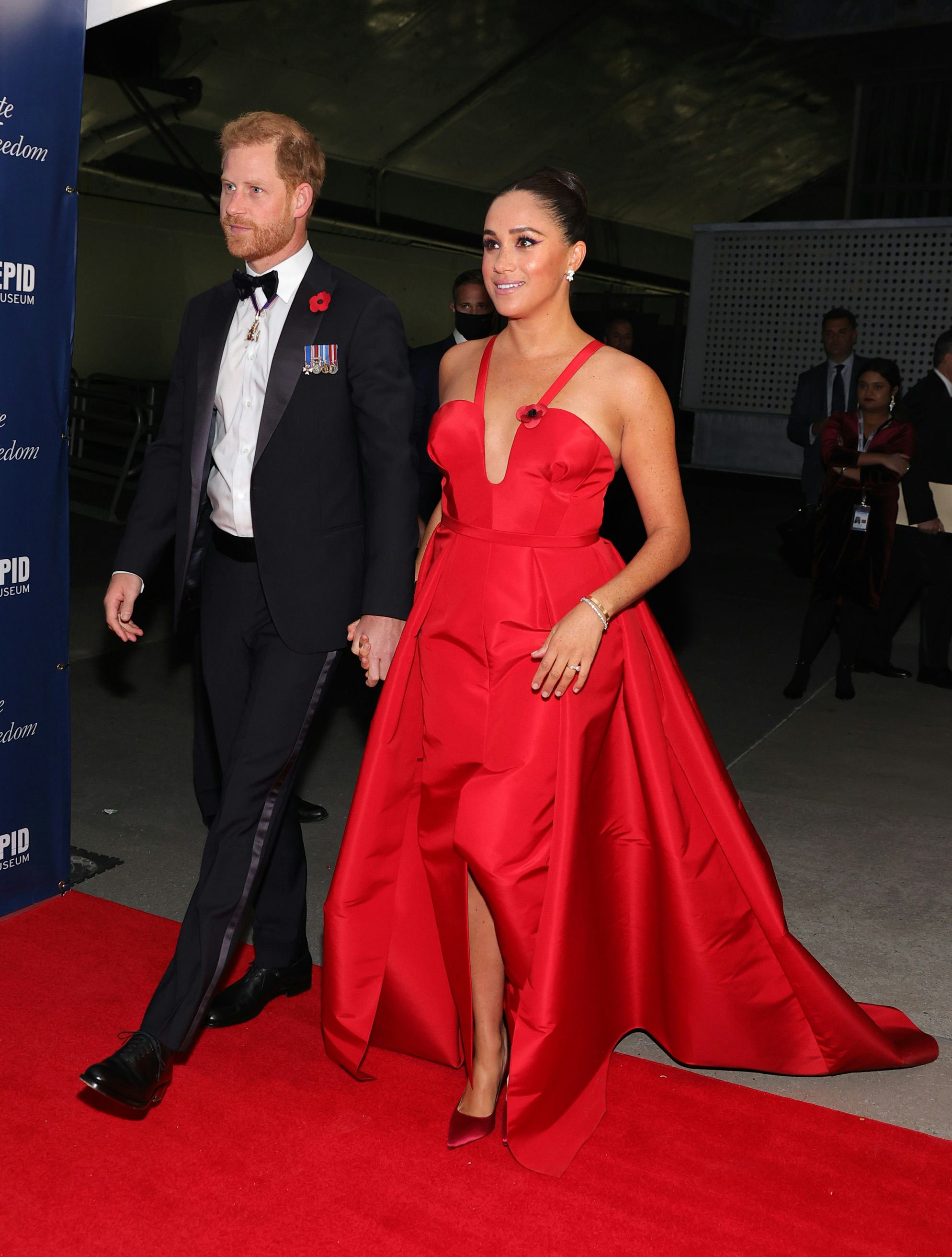 Meghan Markle in a red Carolina Herrera gown.