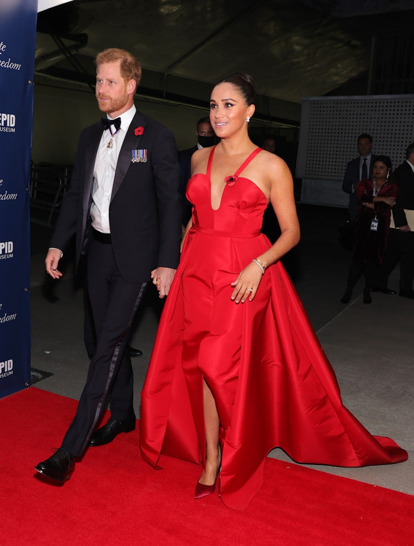 Meghan Markle in a red Carolina Herrera gown.