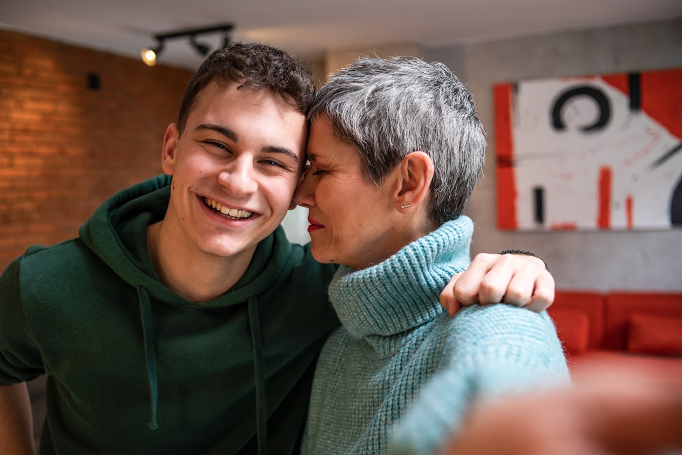 Mom and young adult son and sad about him growing up and not needing her as much.