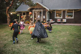 Young kids trick or treating during Halloween.