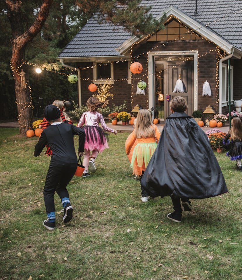 Young kids trick or treating during Halloween.