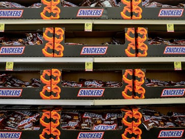 Bags of Mars Inc's Snickers bars at a store in the Harlem neighborhood of New York, US, on Wednesday...