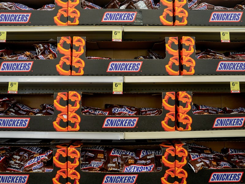 Bags of Mars Inc's Snickers bars at a store in the Harlem neighborhood of New York, US, on Wednesday...