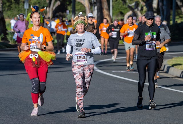 Dana Point, CA - November 24: Festively dressed runners near the finish line as they run in the 45th...