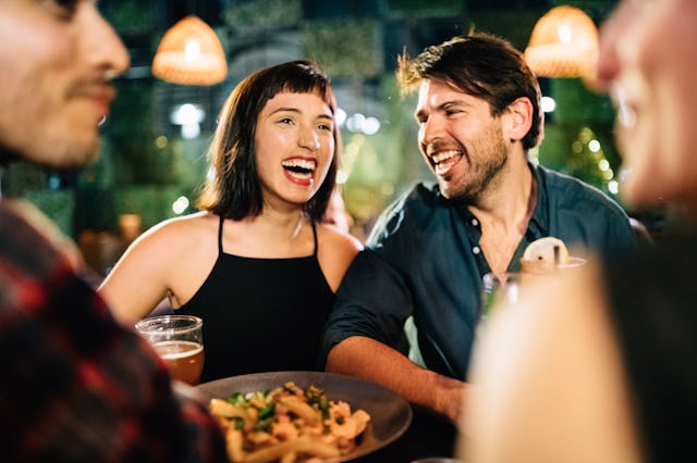 Group of friends hanging out in a Bar at Night, in a story about what to do if you hate your friends...