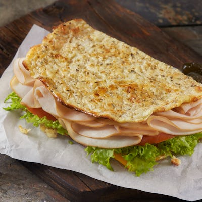 The Viral Cottage Cheese flat Bread Sandwich with Lettuce, Cheddar Cheese, Lettuce, Tomato and Sliced Roast Turkey