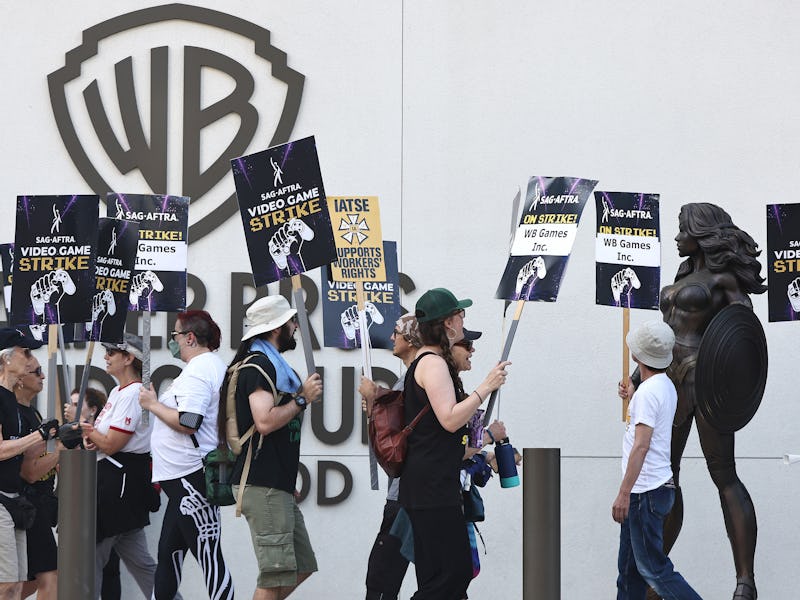 BURBANK, CALIFORNIA - AUGUST 28: Striking SAG-AFTRA video game performers picket near a Wonder Woman...