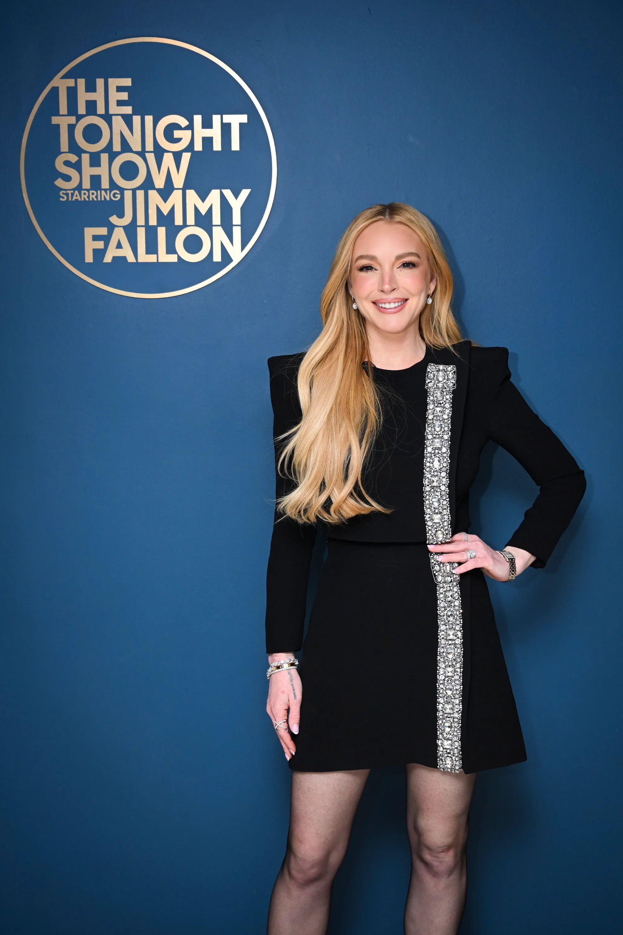 Lindsay Lohan's Semi-Sheer Black Dress Was A Sultry Take On Seasonal Styling