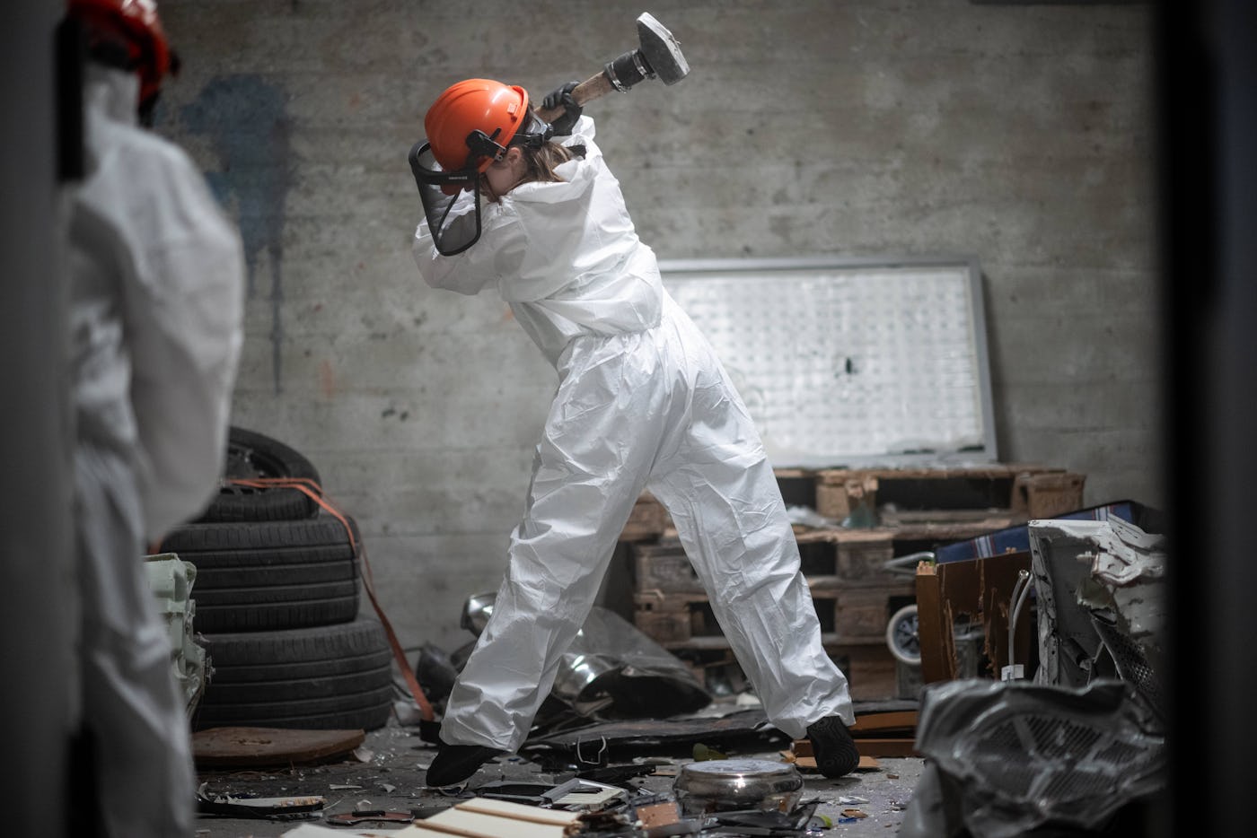PRODUCTION - 24 October 2024, North Rhine-Westphalia, Hattingen: Two visitors hit objects in a rage room at the "Riot Center". This is a so-called "Rage Room". Visitors can smash objects to their heart's content to release their frustration. Photo: Fabian Strauch/dpa (Photo by Fabian Strauch/picture alliance via Getty Images)