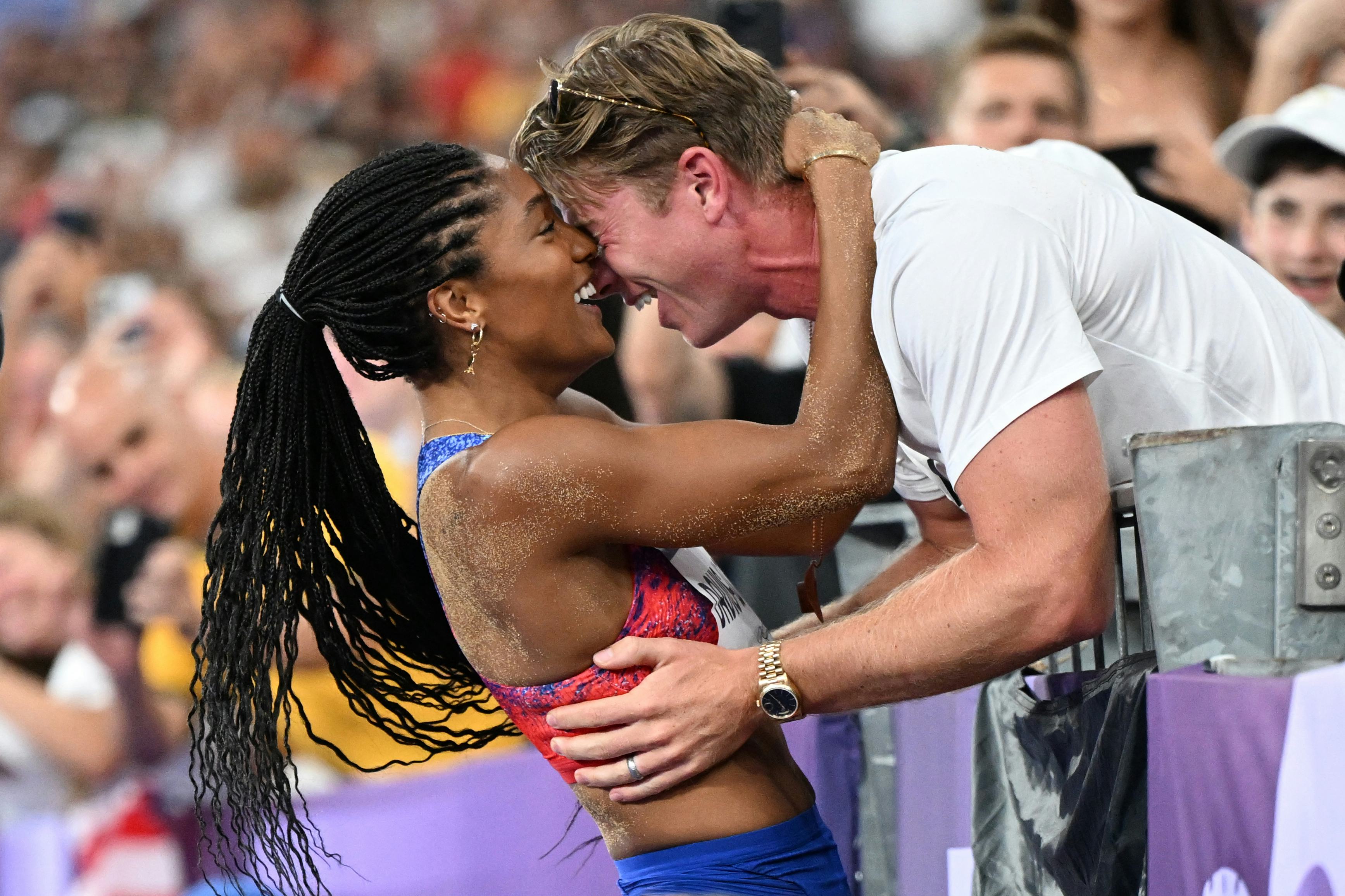 Gold medalist Tara Davis-Woodhall celebrates with her husband, U.S. track and field Paralympic athle&hellip;