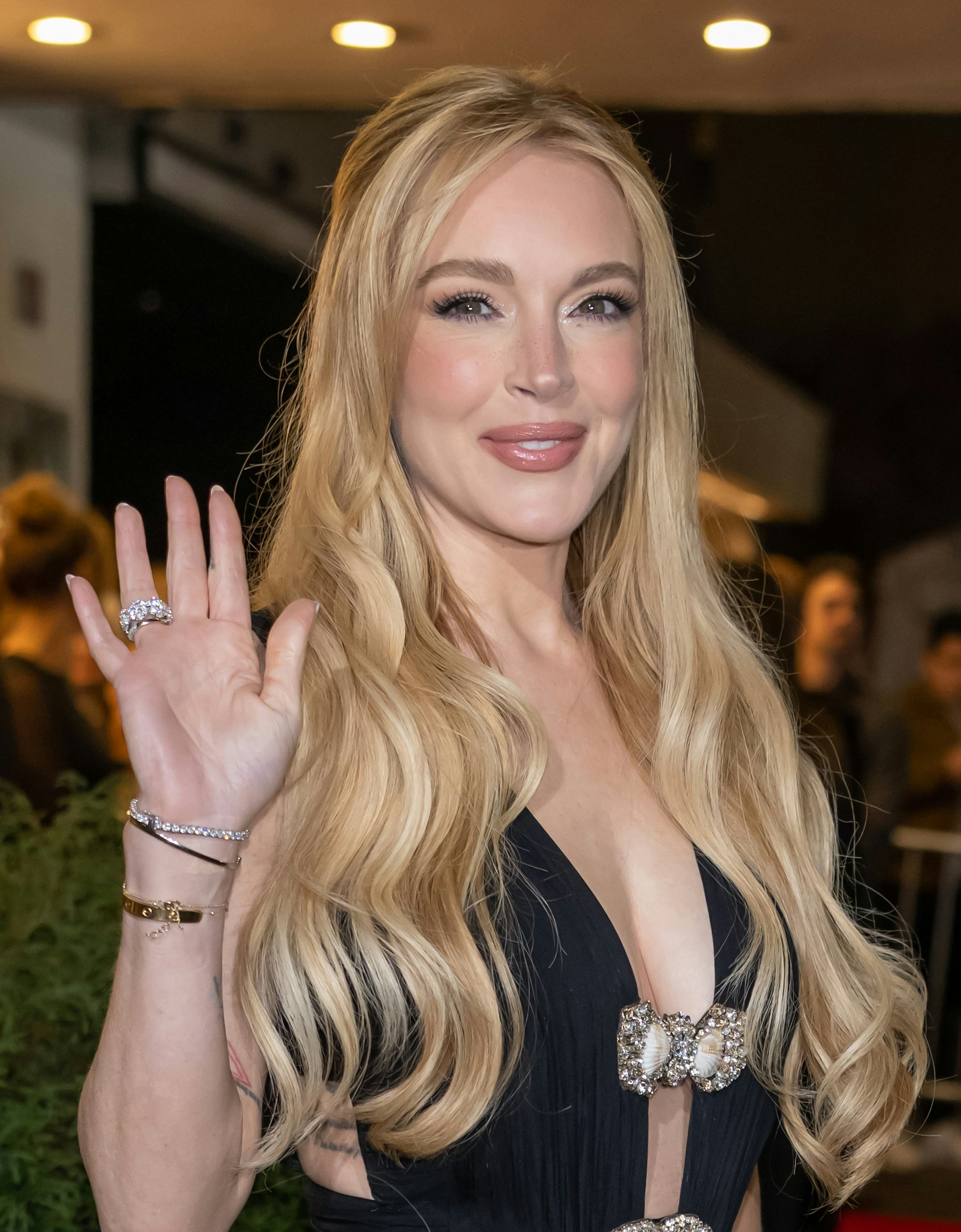 Lindsay Lohan wore a plunging, see-through LBD to her movie premiere.