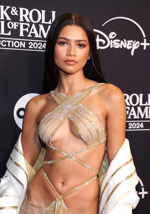Zendaya attends the 2024 Rock & Roll Hall Of Fame Induction Ceremony in a naked, revealing dress.