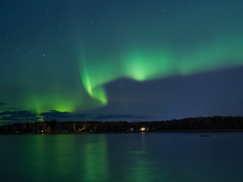This photograph shows Northern lights (Aurora Borealis) illuminating the sky above North of Vaasa, w...