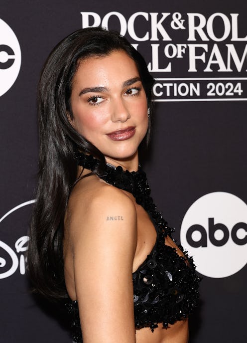 Dua Lipa wore itty-bitty leopard shorts and a cheugy 2010s accessory.