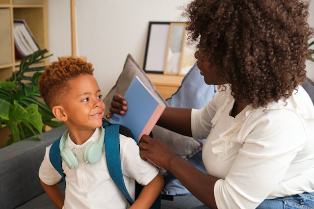 Mother helping her son getting ready for school. The study showed that reframing tasks as learning o...