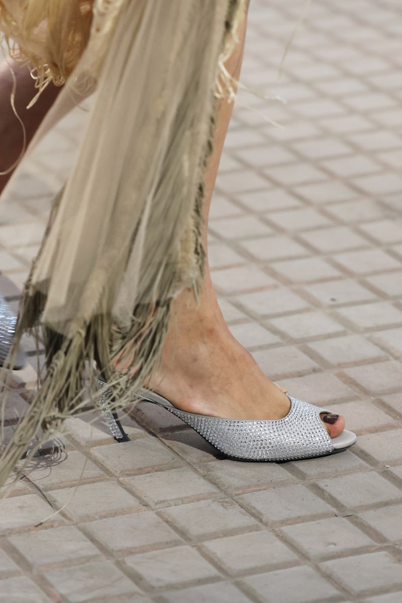 MILAN, ITALY - SEPTEMBER 21: A model, shoe detail, walks the runway at the The Attico fashion show d...
