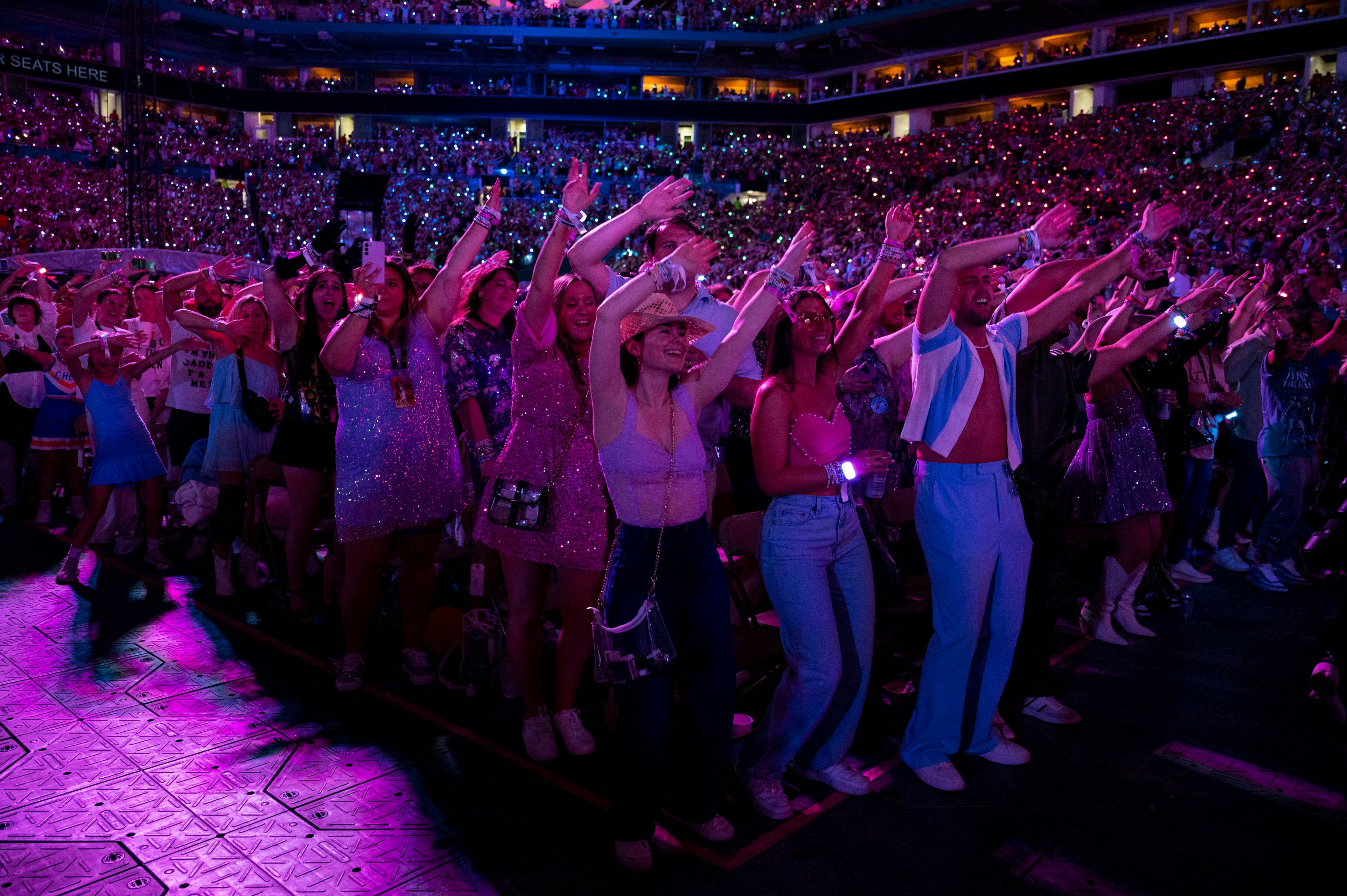 Swifties cheer on Taylor Swift on The Eras Tour.