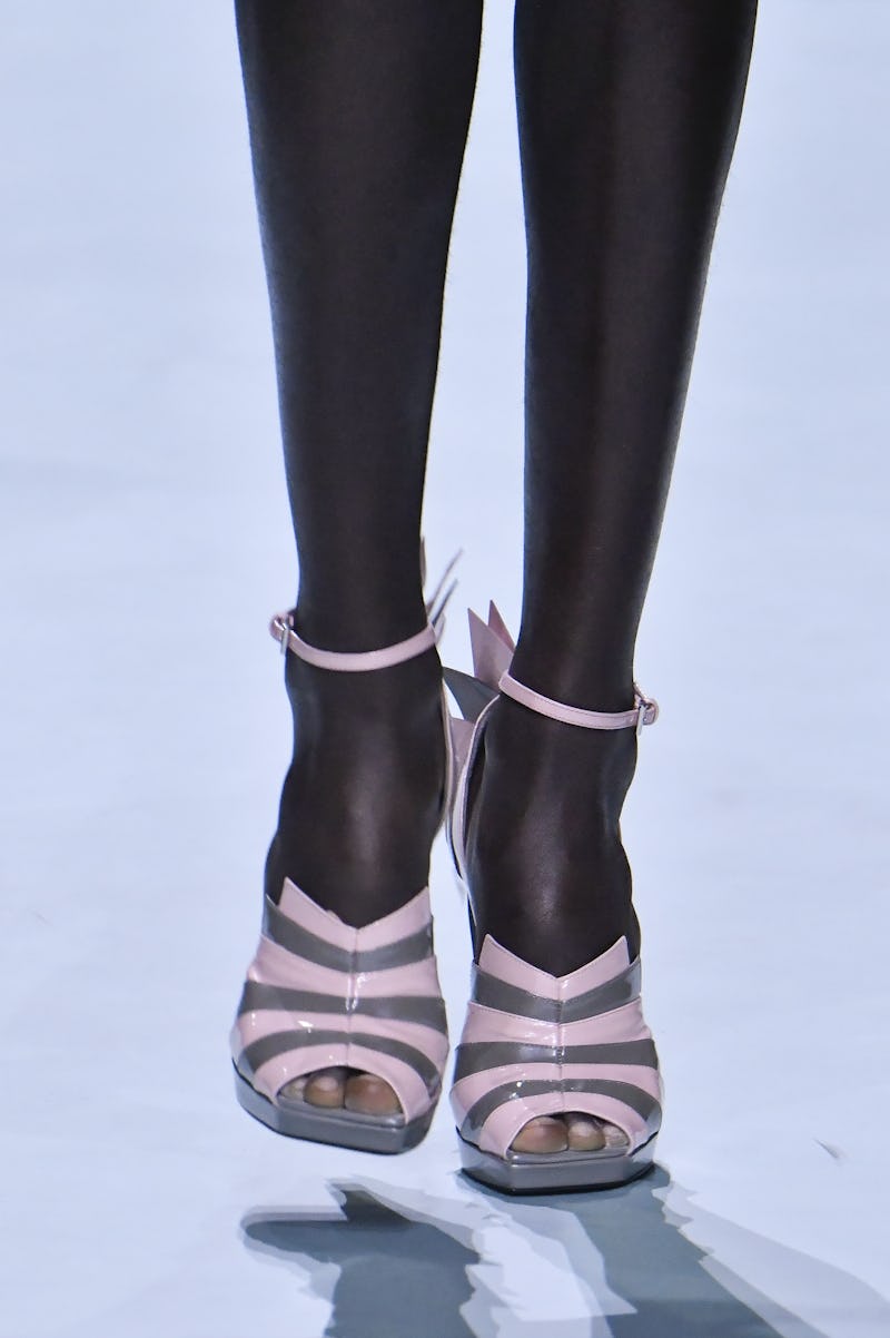 MILAN, ITALY - SEPTEMBER 19: A model walks the runway during the Prada Ready to Wear Spring Summer 2...