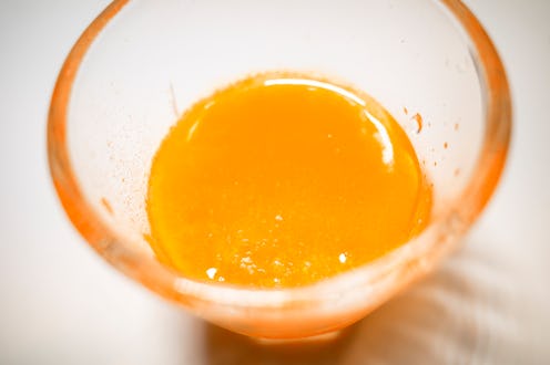 Orange juice in glass on white background