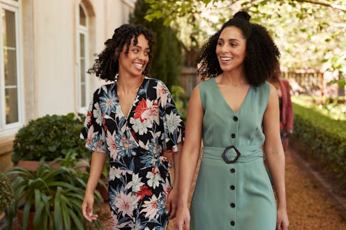 Happy women walking together at wedding party