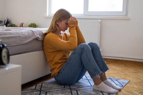 Bored young woman in bedroom