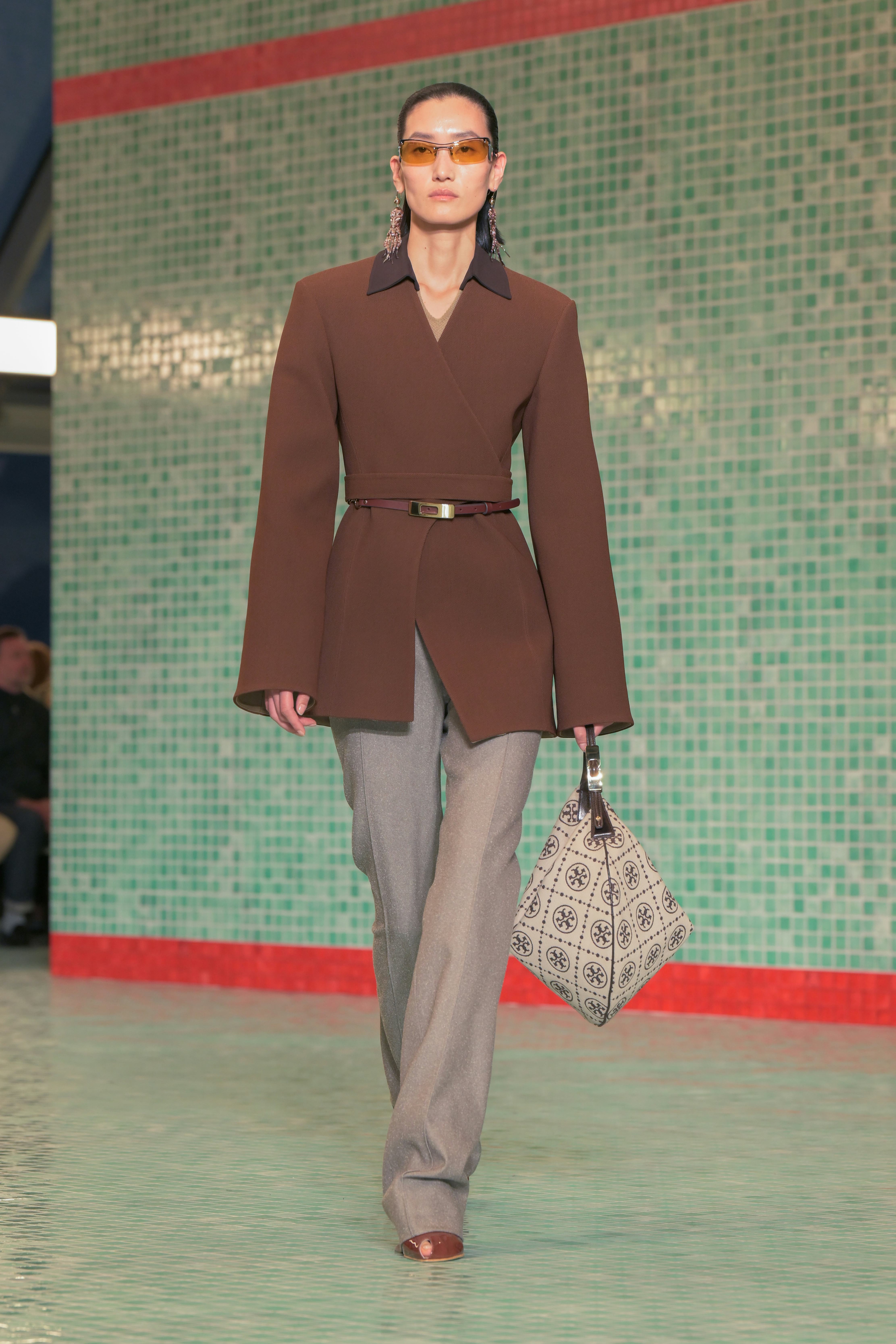 Model on the runway at Tory Burch RTW Spring 2025 held at Skylight at The Refinery as part of New Yo...