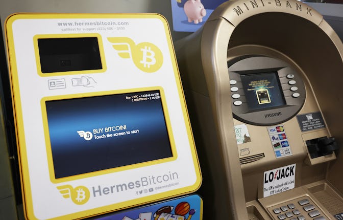 PASADENA, CALIFORNIA - DECEMBER 09: A Hermes Bitcoin ATM stands next to a traditional ATM in a gas s...