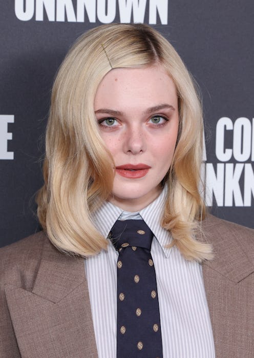 Elle Fanning dress over pants trend