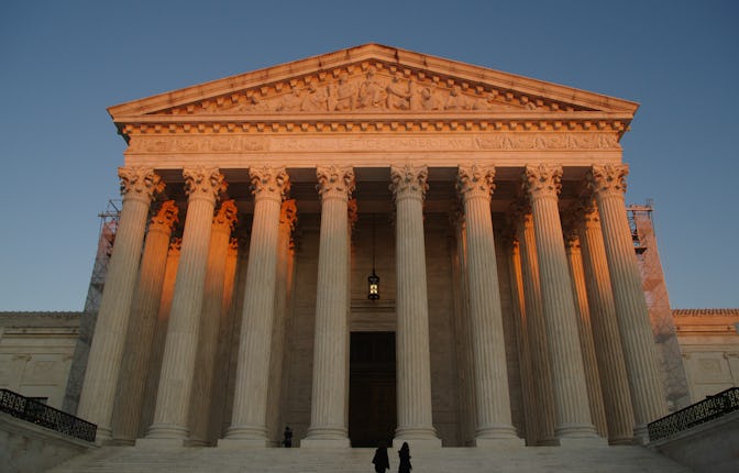 Supreme Court building in Washington, DC, at sunrise.
