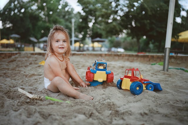 Happy little girl enjoying while playing in sand with her toys.
Leica M6, ektar 100. The negative i...